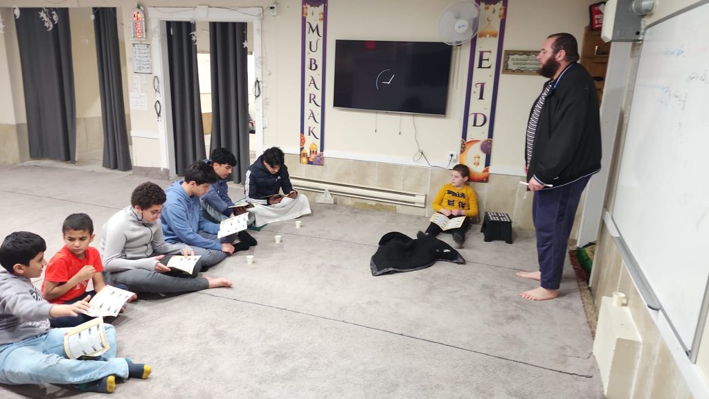 Children participating in an Arabic lesson at Dar Ussalam